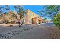 Charming apartment building exterior in a well-maintained community and desert landscaping at 2020 Rancho Lake Drive Dr # 205, Las Vegas, NV 89108