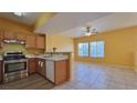 Open kitchen and living area has stainless steel appliances and tiled floors at 2020 Rancho Lake Drive Dr # 205, Las Vegas, NV 89108