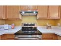 A bright kitchen with stainless steel appliances, light wood cabinets and white countertops at 2020 Rancho Lake Drive Dr # 205, Las Vegas, NV 89108