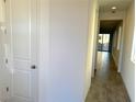 Bright hallway with tile flooring and doors to other rooms at 9922 Angel Valley Dr, Las Vegas, NV 89178