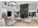 Bright living room featuring a large fireplace and hardwood floors at 2337 Prometheus Ct, Henderson, NV 89074