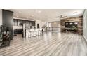 Spacious kitchen with an island, stainless steel appliances, and dark cabinets at 10414 White Princess Ave, Las Vegas, NV 89166