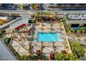 Resort-style pool with ample lounge chairs and shade structures at 125 E Harmon Ave # 3716, Las Vegas, NV 89109