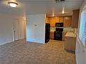 Open floor plan with kitchen and living area, tile floors throughout at 3367 Villa Fiori Ave, Las Vegas, NV 89141