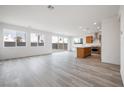 Open concept kitchen with island, stainless steel appliances, and wood cabinets at 1722 Game Garden Rd, North Las Vegas, NV 89031