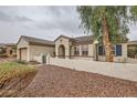 Charming single-story home featuring a tile roof and desert landscaping, creating inviting curb appeal at 3005 Noblesville Ct, Henderson, NV 89052