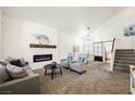 Spacious living room with fireplace and modern furniture at 841 Glitter Glen Ct, Las Vegas, NV 89123