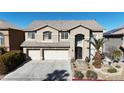 Two-story house with three-car garage and landscaped yard at 8508 Vivid Violet Ave, Las Vegas, NV 89143