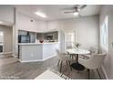 Dining area with a white marble table and gray chairs at 900 Heavenly Hills Ct # 217, Las Vegas, NV 89145