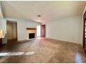 Living room with fireplace and access to patio at 4140 Gannet Cir # 251, Las Vegas, NV 89103