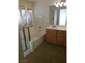 Bathroom with a bathtub, shower, and double vanity at 6019 Orca Lilly St, North Las Vegas, NV 89031