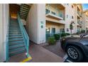 Condo building entrance with stairs, unit number 10, and manicured landscaping for a welcoming feel at 3550 Bay Sands Dr # 2076, Laughlin, NV 89029