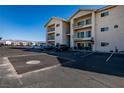 Attractive multi-story condo building with private balconies and parking set against a desert and mountain backdrop at 3550 Bay Sands Dr # 2076, Laughlin, NV 89029