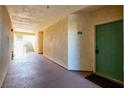 Well-lit hallway of condo building featuring unit number 2076 and staircase access to other floors at 3550 Bay Sands Dr # 2076, Laughlin, NV 89029