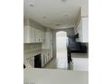 Bright kitchen with white cabinets, granite countertops, and stainless steel appliances at 1509 Blanco Dr, North Las Vegas, NV 89031