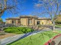 Single-story home with landscaped yard and attached garage at 309 Rosegate Ave, Henderson, NV 89052