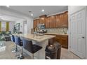 Spacious kitchen island with granite countertops and stainless steel appliances at 4343 Countryside Glen Ct, North Las Vegas, NV 89084