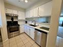 Bright kitchen featuring stainless steel appliances and white cabinetry at 2056 Mesquite Ln # 303, Laughlin, NV 89029