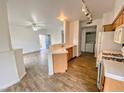 Bright kitchen featuring tile countertops and flooring adjacent to the living space at 2100 Black Island St # 101, Las Vegas, NV 89128