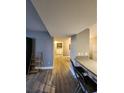 Hallway view features hardwood floors and access to the laundry room at 2725 S Nellis Blvd # 1105, Las Vegas, NV 89121
