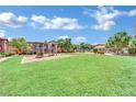 Community green space with playground and pool at 8000 W Badura Ave # 2106, Las Vegas, NV 89113