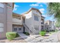 Condo building exterior with walkway and landscaping at 8000 W Badura Ave # 2106, Las Vegas, NV 89113