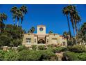 Well-maintained, luxury home featuring desert landscaping, a unique architectural design, and a tile roof at 230 E Flamingo Rd # 212, Las Vegas, NV 89169