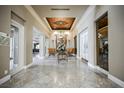 Grand foyer with marble flooring, decorative ceiling, and elegant furnishings creating a luxurious entrance at 230 E Flamingo Rd # 212, Las Vegas, NV 89169