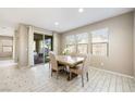 Dining area with table and chairs, access to backyard at 3094 Isle Dr, Las Vegas, NV 89141