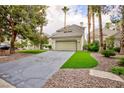 Charming single-Gathering home with a two-car garage, concrete driveway, and mature trees at 3146 Bel Air Dr, Las Vegas, NV 89109