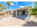 Covered patio with a brick surface, providing a comfortable outdoor living space at 3591 Driving Range St, Las Vegas, NV 89122