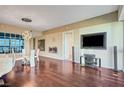 Living room features hardwood floors, fireplace, and built in entertainment center at 4471 Dean Martin Dr # 3908, Las Vegas, NV 89103