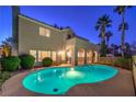 Inviting kidney-shaped pool surrounded by a fenced backyard at 18 Tarryall Ter, Henderson, NV 89074