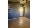 Simple bedroom with tile floors and built-in shelving at 5217 Chesapeake Cir, Las Vegas, NV 89108