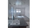 An updated kitchen with tiled floors and granite countertops offers a modern touch at 1381 E University Ave # 102, Las Vegas, NV 89119