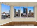 Living room with hardwood floors and stunning city views at 222 Karen Ave # 1702, Las Vegas, NV 89109