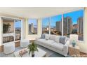 Living room features large windows and city views at 222 Karen Ave # 1702, Las Vegas, NV 89109