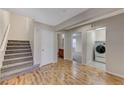 Modern staircase leading to upper level with laundry and bathroom access at 366 Ambitious St, Henderson, NV 89011