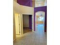 Bright hallway featuring tile flooring and neutral-colored walls at 5048 Orchid Springs St, Las Vegas, NV 89148