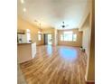 Spacious living room featuring hardwood floors, high ceilings, and ample natural light at 5048 Orchid Springs St, Las Vegas, NV 89148