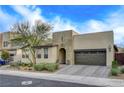 Elegant curb appeal with a modern facade and driveway at 1705 Dream Canyon Ave, North Las Vegas, NV 89084