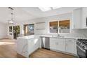 Modern kitchen with white cabinets and quartz counters at 2612 Springridge Dr, Las Vegas, NV 89134