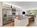 Contemporary kitchen with stainless steel appliances and a stylish island with counter seating at 3722 Las Vegas Blvd # 2309, Las Vegas, NV 89158
