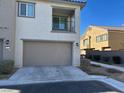 Townhouse exterior with attached garage and balcony at 7368 N Decatur Blvd # 1, Las Vegas, NV 89131