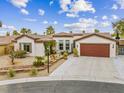Single-story house with a two-car garage and desert landscaping at 8229 Flowing Rapids Ct, Las Vegas, NV 89131