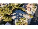 Top-down view of a house with gray roof and a swimming pool at 10008 Rolling Glen Ct, Las Vegas, NV 89117