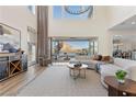 Bright living room showcasing a sectional sofa and high ceilings at 11250 Torch Cactus Dr, Las Vegas, NV 89138