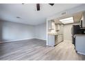 Bright living room with wood-look floors and access to patio at 1865 Apricot Ct, Henderson, NV 89014