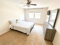 Spacious bedroom with carpeted floors and a dresser at 2831 Geary Pl # 2921, Las Vegas, NV 89109