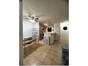 Bright dining area with tile floors and a ceiling fan at 2961 Juniper Hills Blvd # 102, Las Vegas, NV 89142